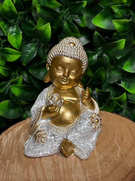 Sitting Buddha in White Pearlized & Gold holding lotus