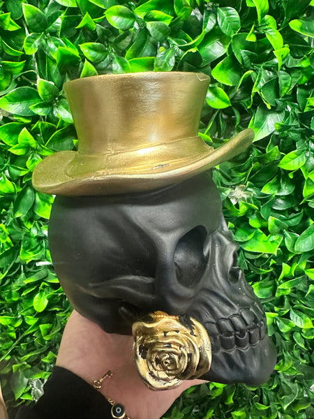 Black skull with gold top hat and rose