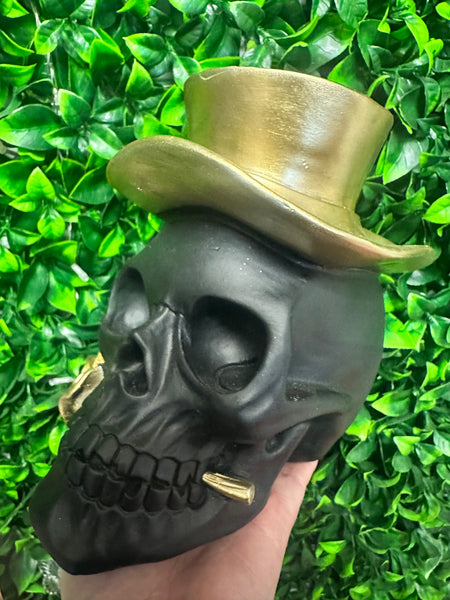 Black skull with gold top hat and rose