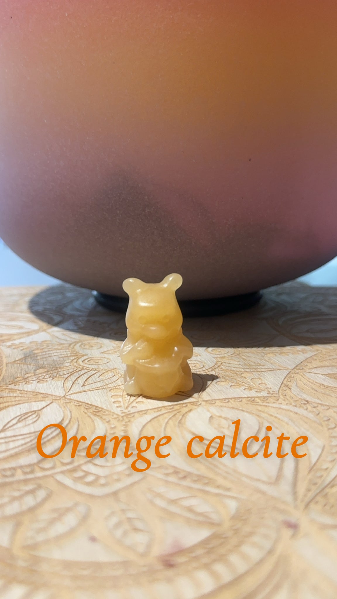 Pooh orange calcite carving