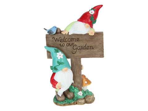 Gnomes with “welcome to our garden”sign